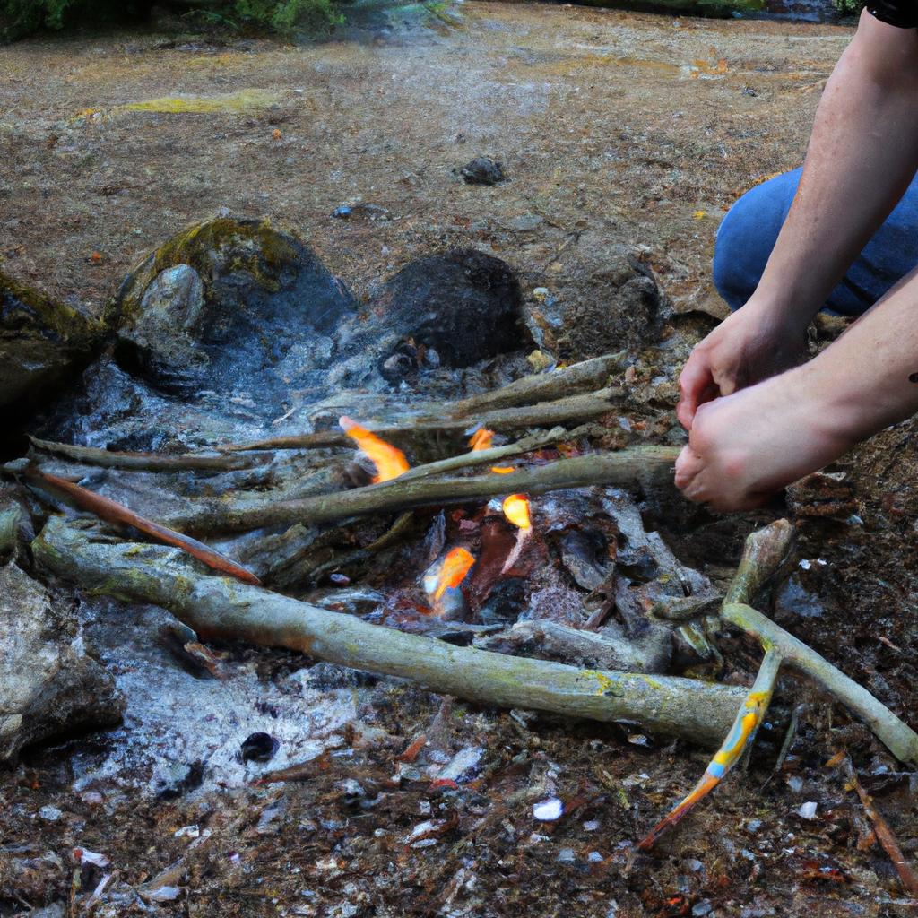 Person setting up campfire safely